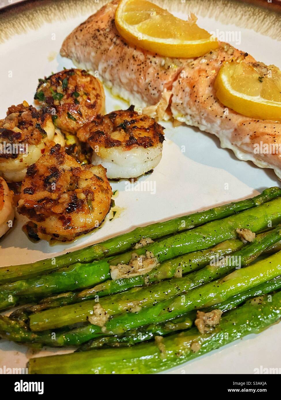 Pan seared Shrimp, oven baked salmon with asparagus Stock Photo Alamy