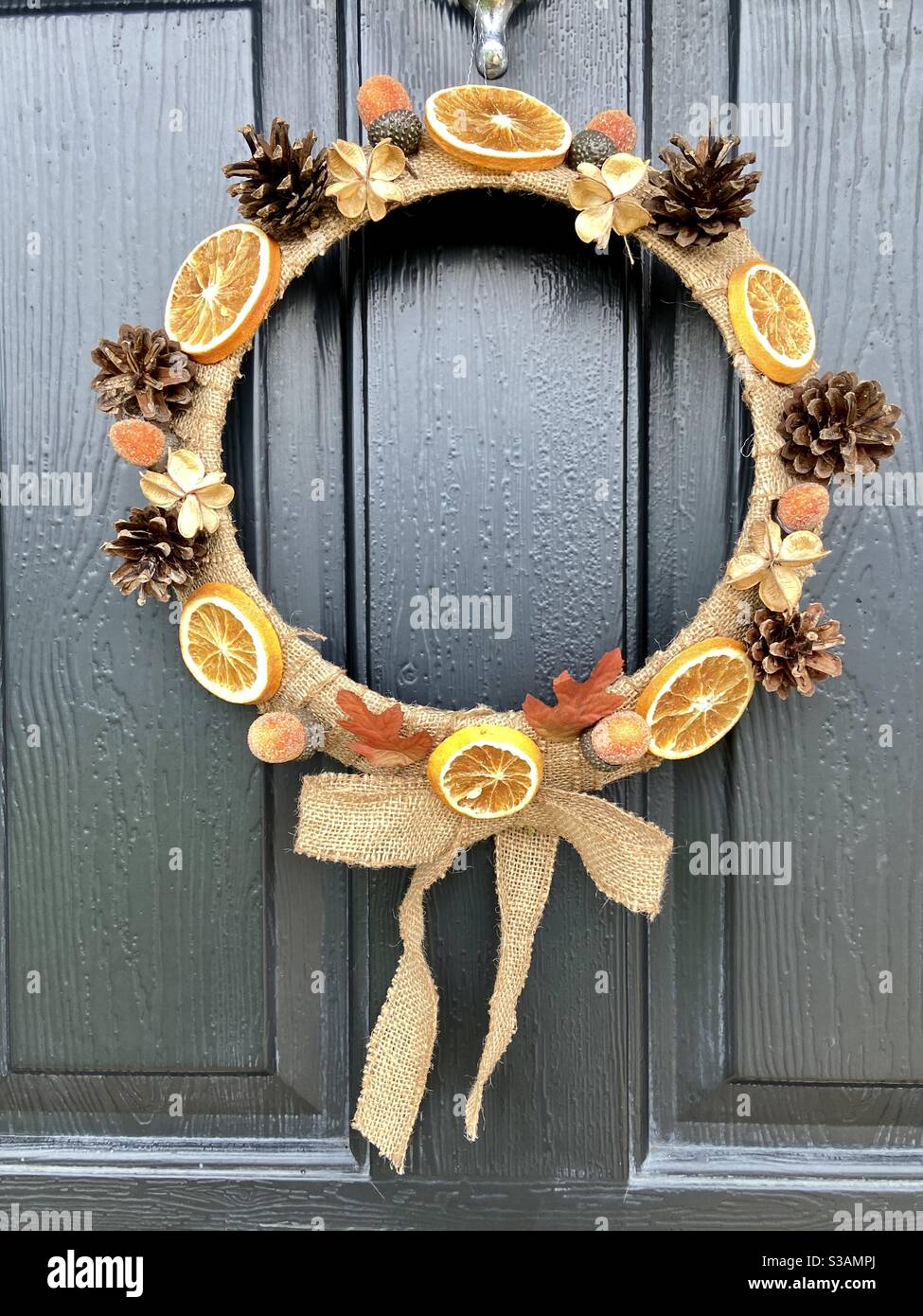 Autumn door wreath on black door - Smartphone Captured Stock Image