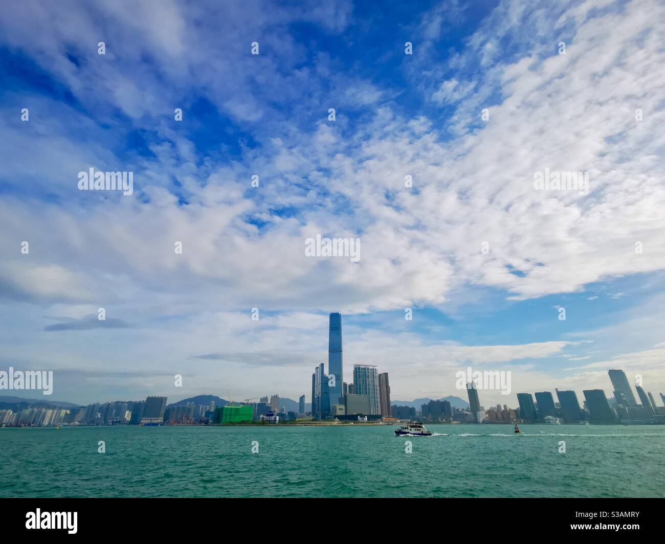 A view of western Kowloon and Victoria harbour in Hong Kong. - Smartphone Captured Stock Image