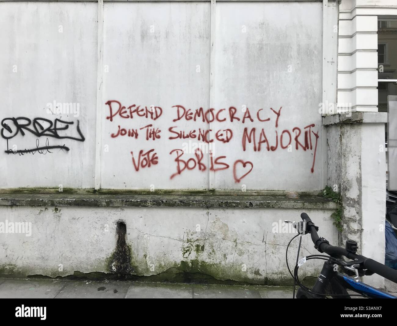 Defend Democracy Graffiti, Notting Hill Gate. Stock Photo