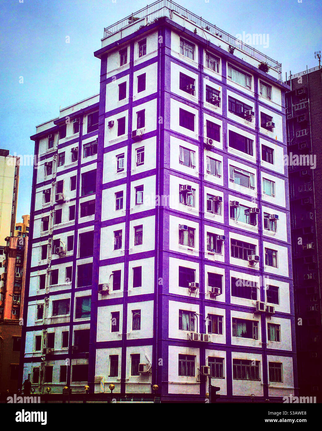 Purple tower building in old areas or district of Hong Kong - Smartphone Captured Stock Image