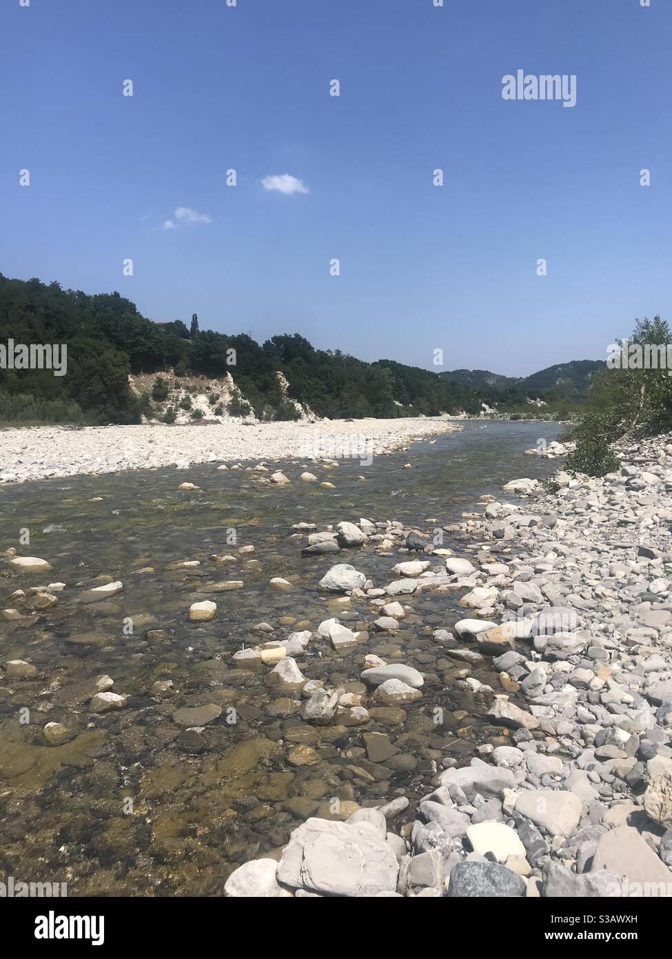 The River Ceno, Varano de’ Melegari, surrounded by hills in Emilia Romagna, Northern Italy - Smartphone Captured Stock Image