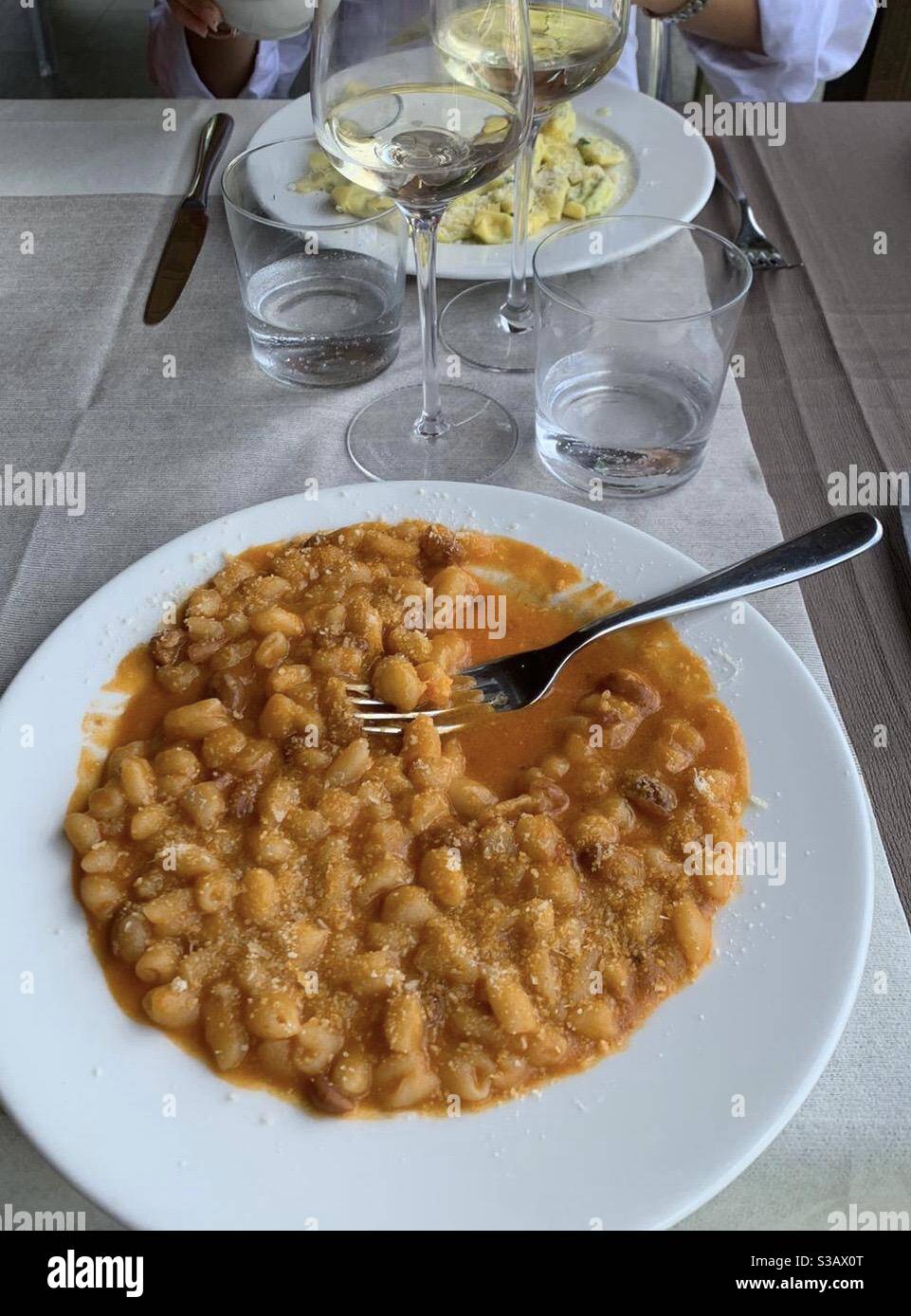 Small gnocchi shaped pasta in a sauce of beans and lard - Smartphone Captured Stock Image