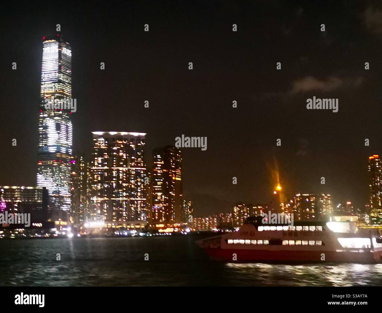 Icc tower and Victoria harbour at night. - Smartphone Captured Stock Image