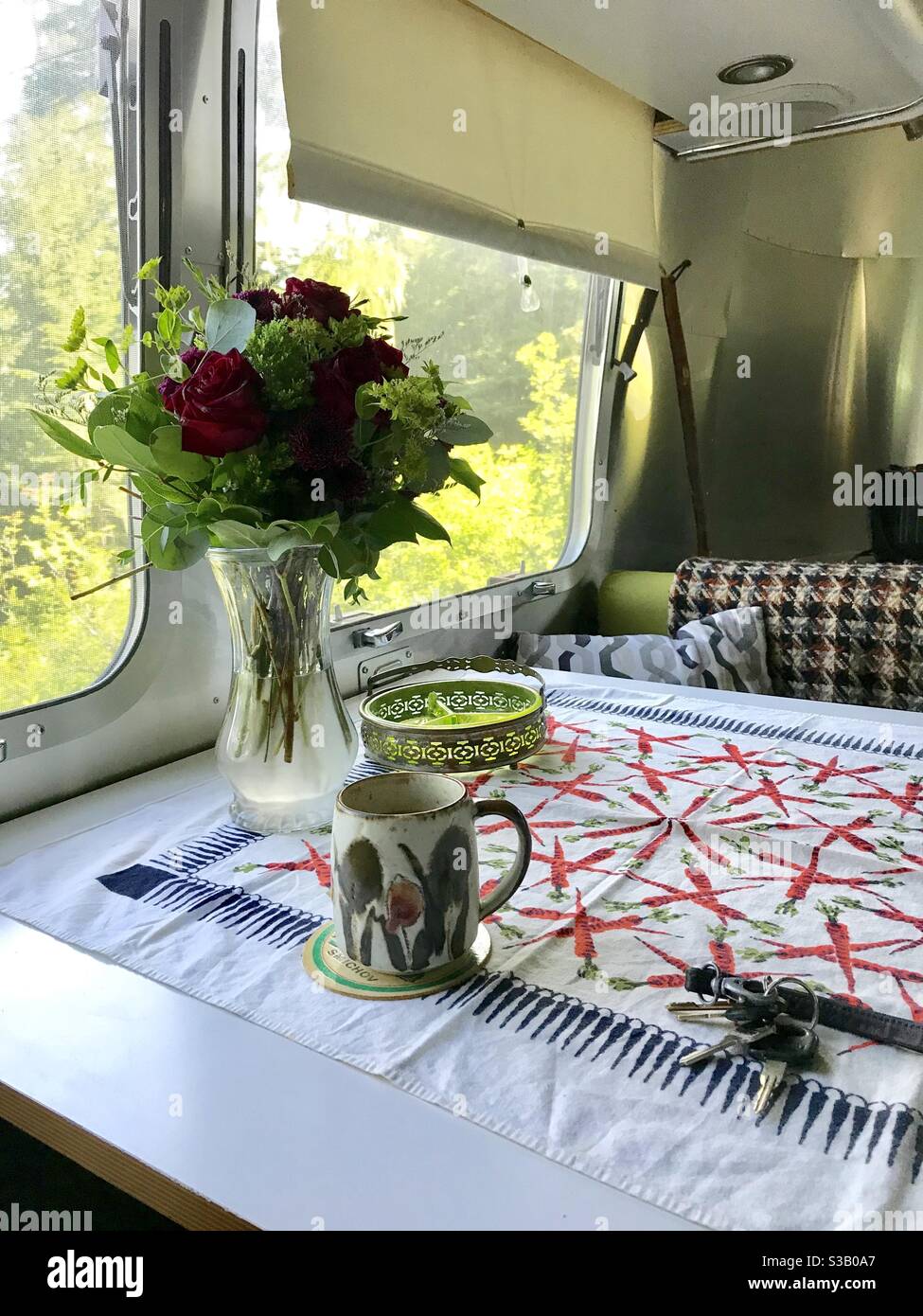 Morning coffee in Airstream travel trailer tiny home Stock Photo