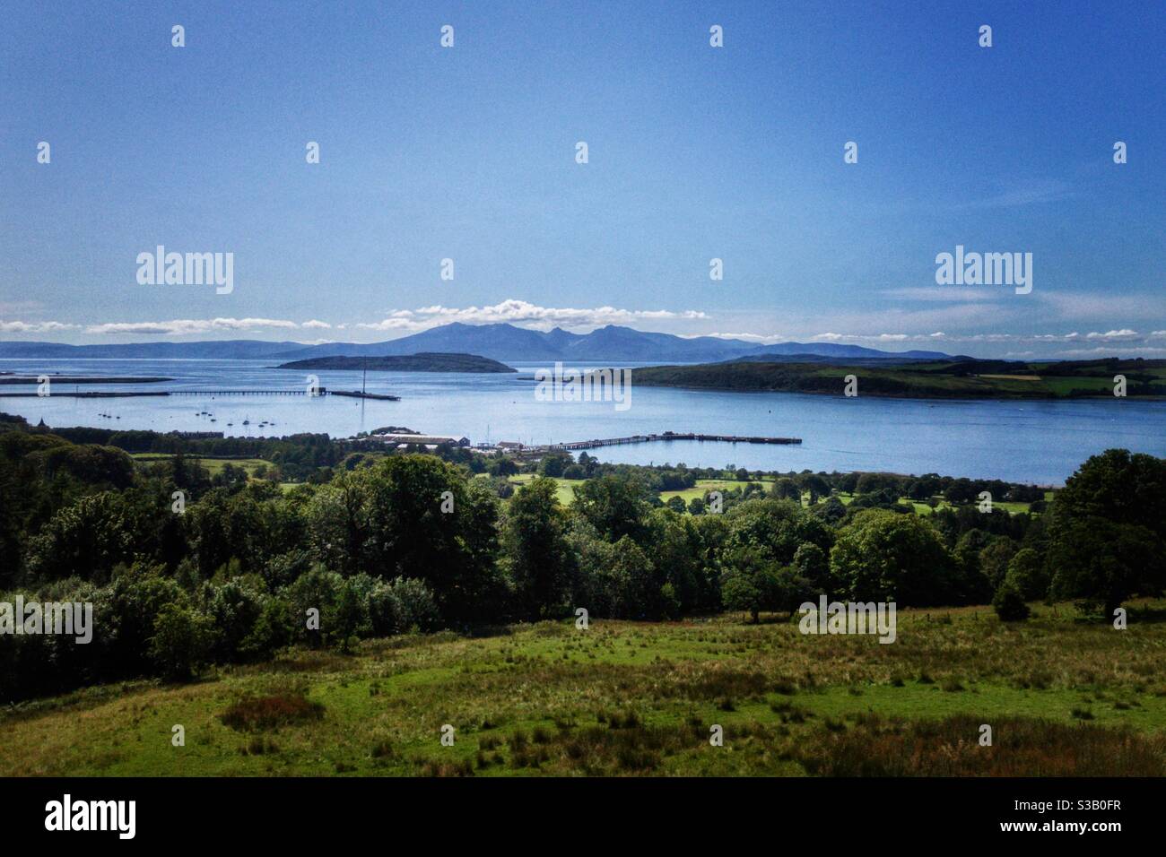 View of Cumbrae, Little Cumbrae, Bute and Arran from the west coast of Scotland. Stock Photo