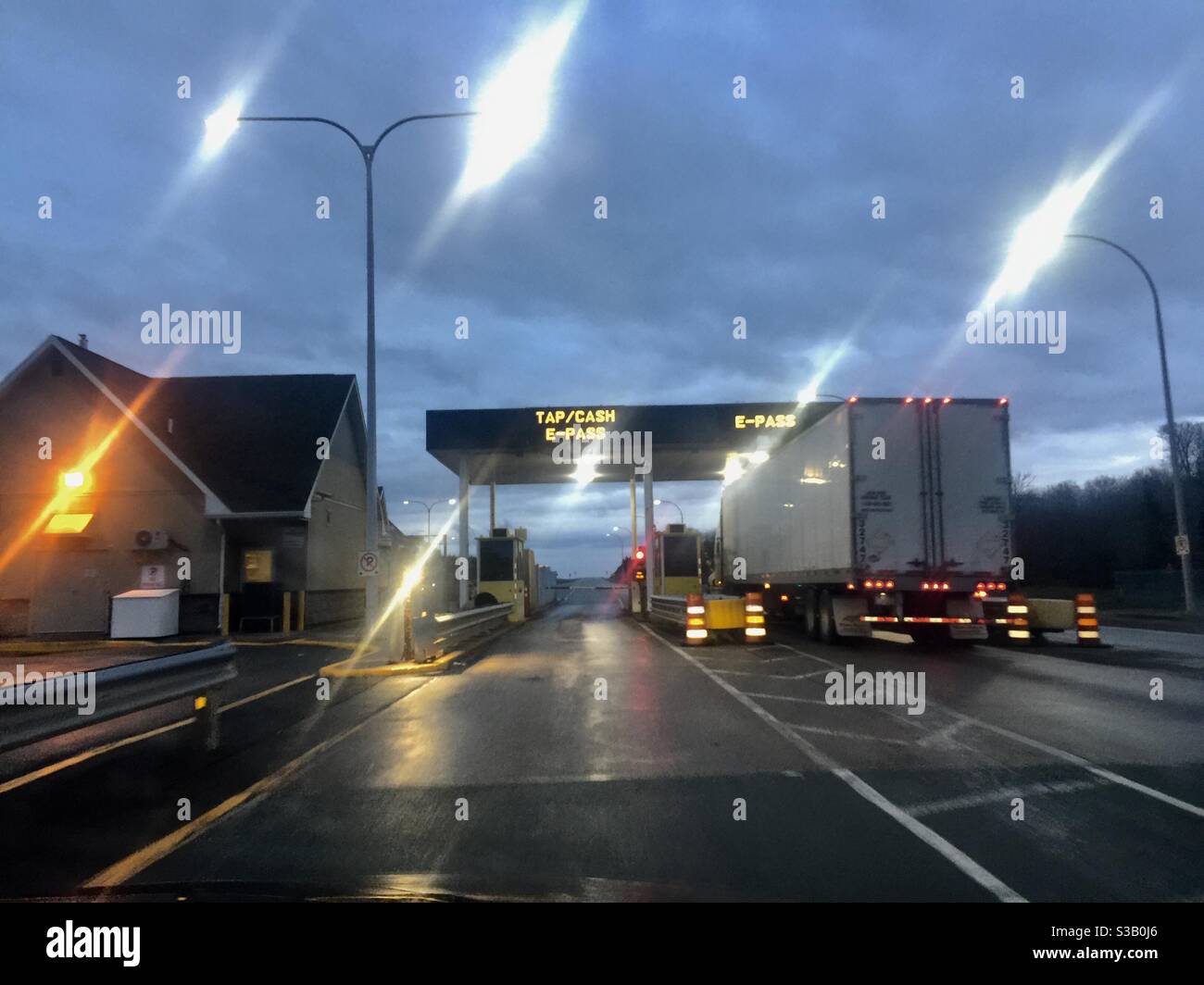 A Truck at a toll booth on a major motorway, Canada - Smartphone Captured Stock Image