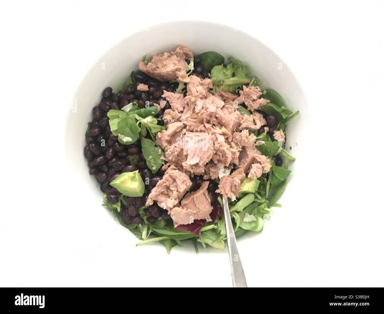Tuna, bean and avocado salad served in a white bowl - Smartphone Captured Stock Image