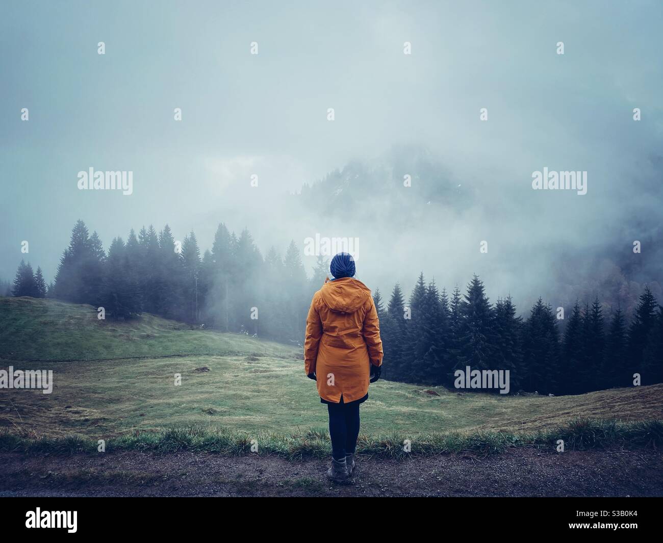A woman in the Bavarian alps in Autumn, Bolsterlang, Allgaeu - Smartphone Captured Stock Image