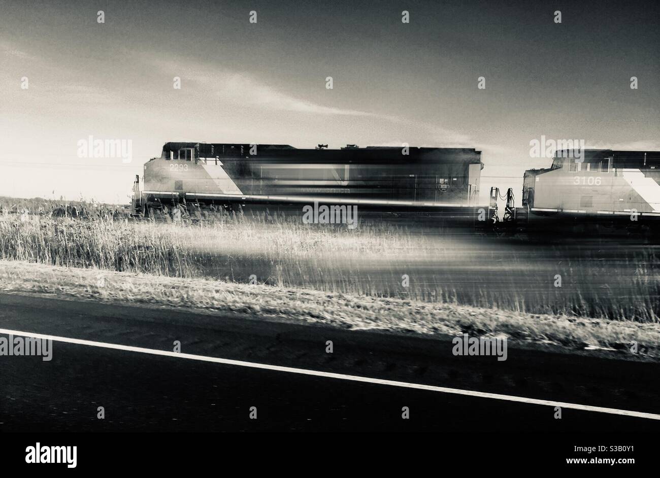 Fast train parallel to the road, Canada - Smartphone Captured Stock Image