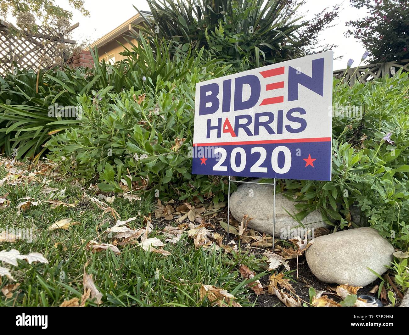 THOUSAND OAKS, CA, NOV 2020: Biden-Harris sign for the United States presidential election campaign at a yard in a suburban neighborhood - Smartphone Captured Stock Image