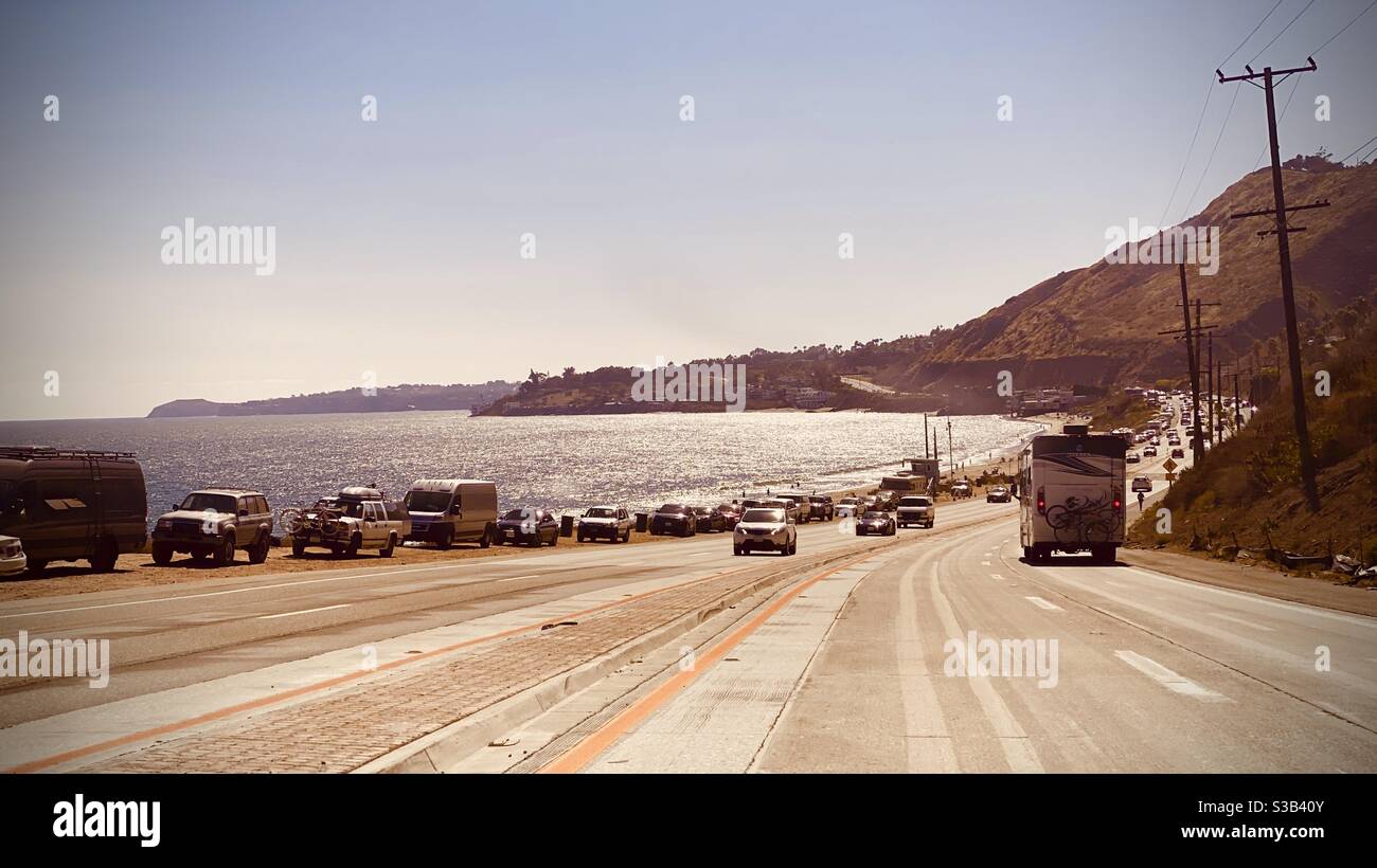 MALIBU, CA, JUL 2020: Pacific Coast Highway with cars and camper vans traveling to vacation spots and beaches - Smartphone Captured Stock Image