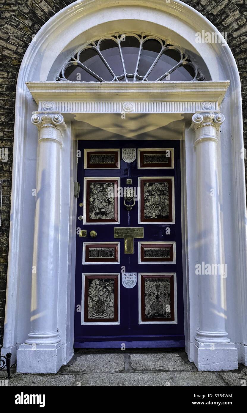 The striking door in Merrion Square in Dublin Ireland commissioned by Donal O Buachalla owner of the property company based here. Marking Dublins year as European Culture Capital in 1991. - Smartphone Captured Stock Image