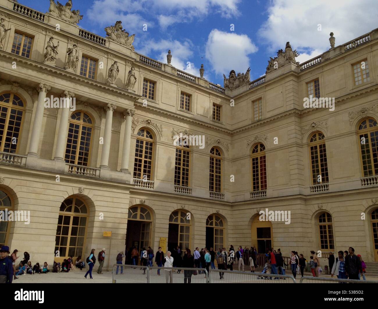 Exterior of the palace of Versailles with tourists on the plaza, Versailles , France. - Smartphone Captured Stock Image