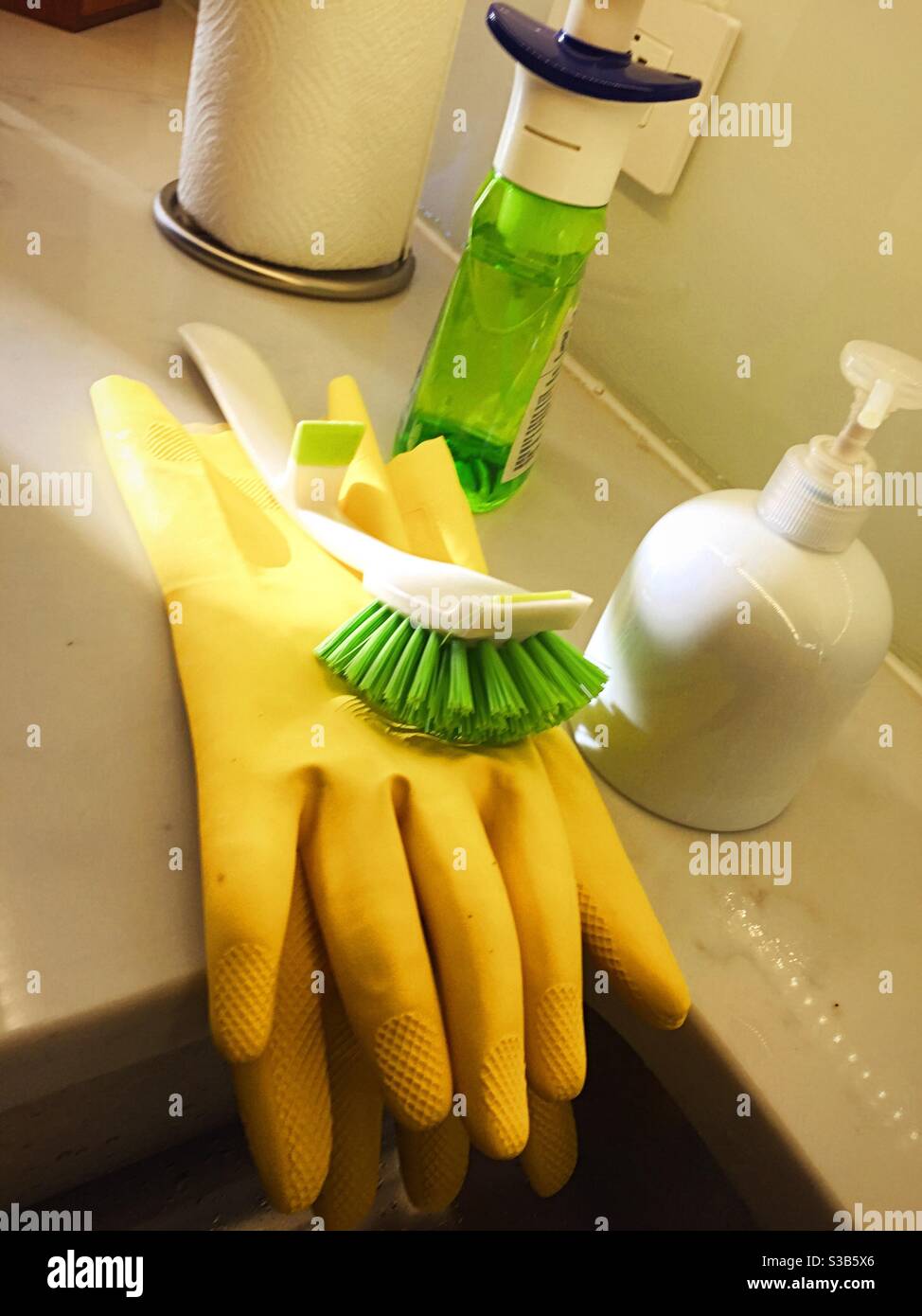 Still life of cleaning products and rubber gloves  on a residential kitchen counter, USA - Smartphone Captured Stock Image
