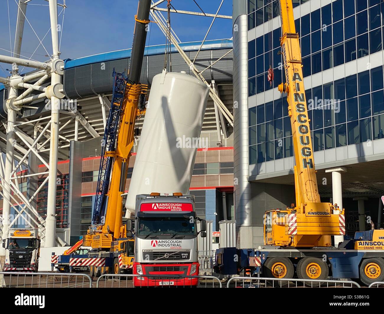 Heavy lift mobile cranes removing an oxygen tank from the Nightingale hospital set up in Cardiff’s Principality Stadium to help deal with the Covid pandemic - Smartphone Captured Stock Image