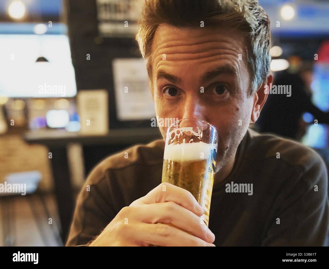 Man drinking beer - Smartphone Captured Stock Image