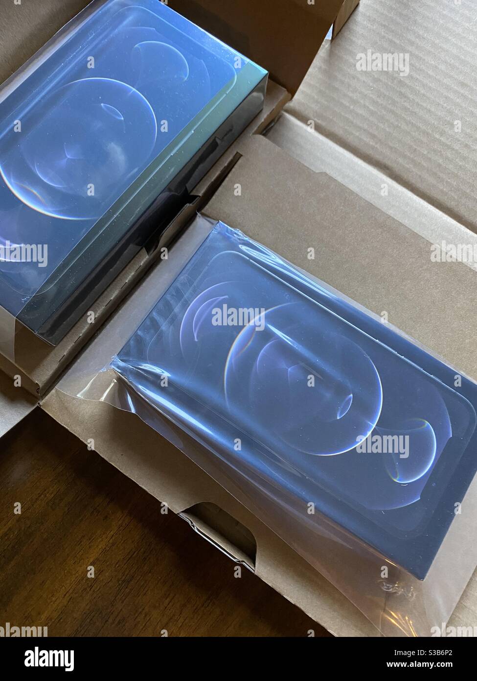 New Apple iPhone 12 pro and pro max phones with shipping boxes Stock Photo