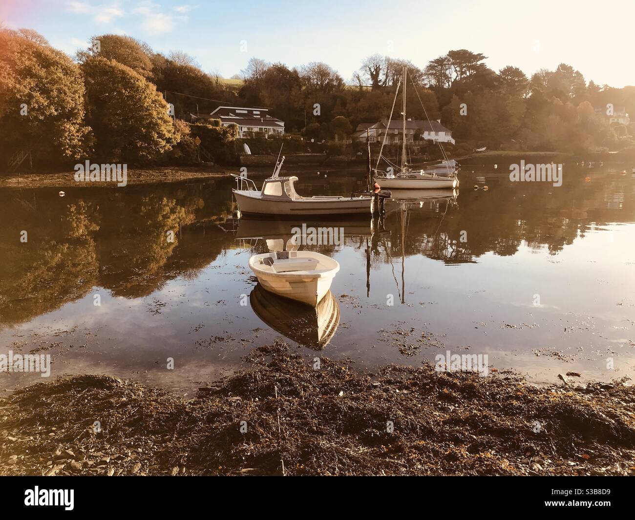 three boats in Pill Creek reflections - Smartphone Captured Stock Image