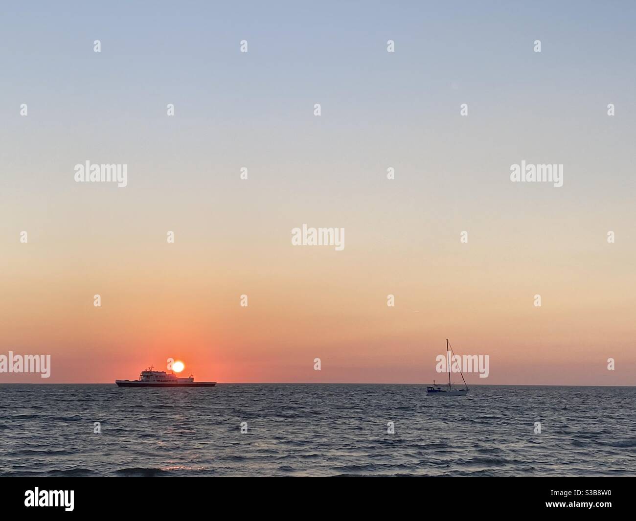 Hatteras-Ocracoke Ferry at sunset on Pamlico Sound. Stock Photo