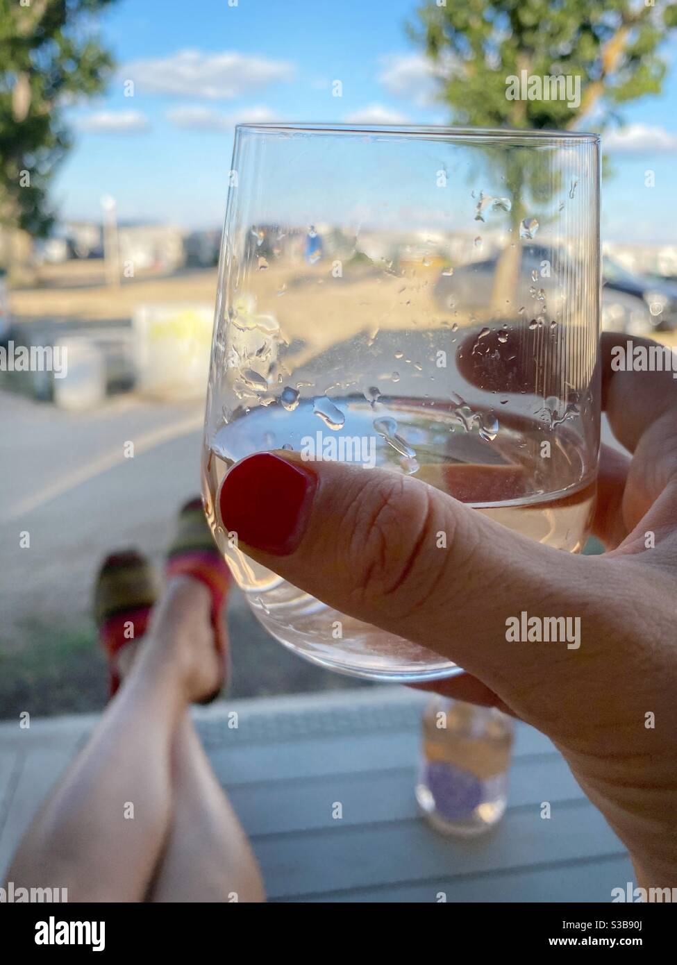 Woman holding wine glass - Smartphone Captured Stock Image