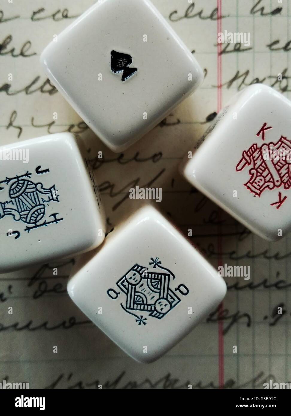 Group of dice close up with queen king ace and jack Stock Photo