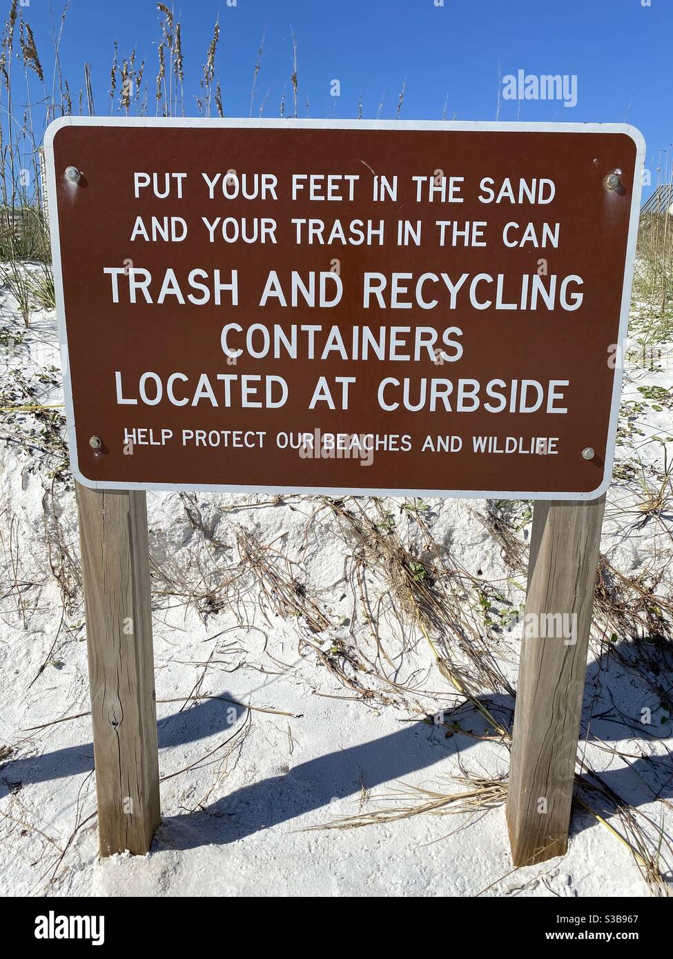Public message sign to keep the beach clean Stock Photo