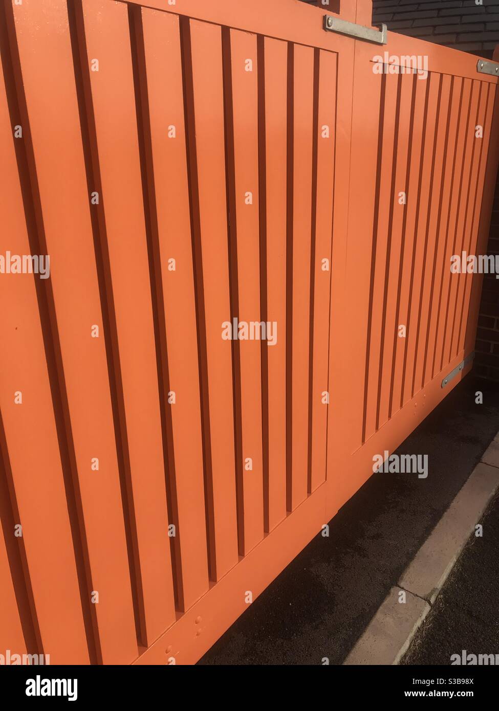 Orange painted gate Stock Photo
