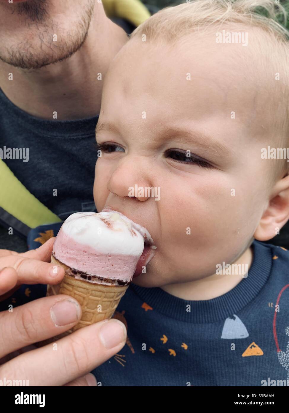 Toddler eating ice cream Stock Photo Alamy