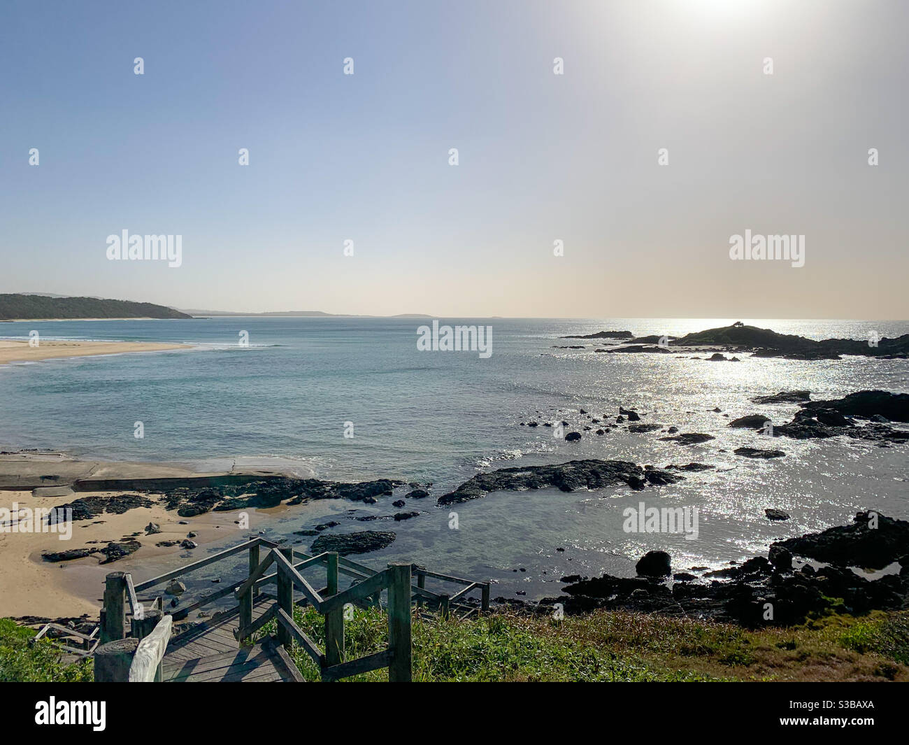 Seascape. Stair that lead down to the beach and ocean on a clear day, Australia - Smartphone Captured Stock Image