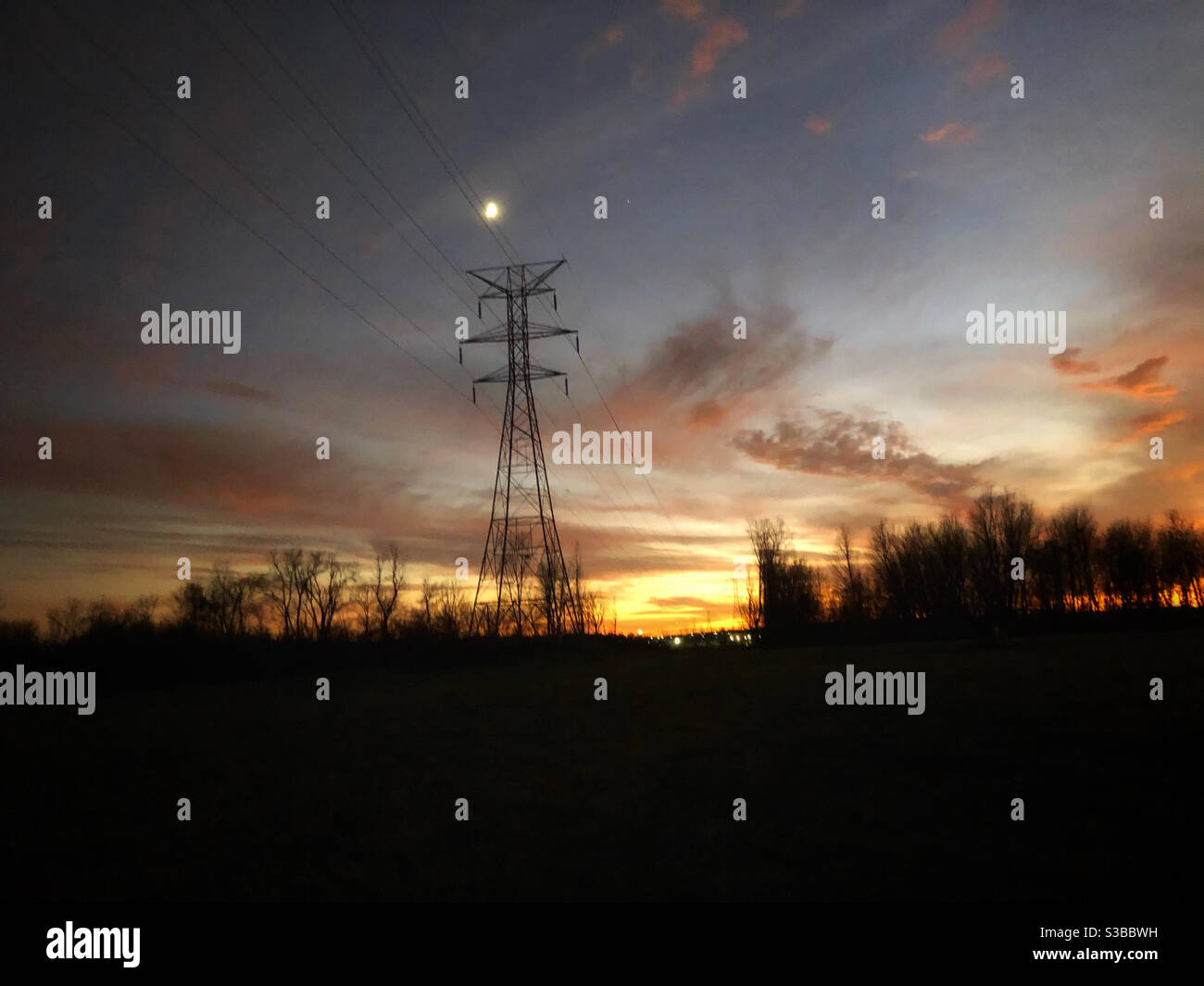 Transmission tower at sunset. - Smartphone Captured Stock Image