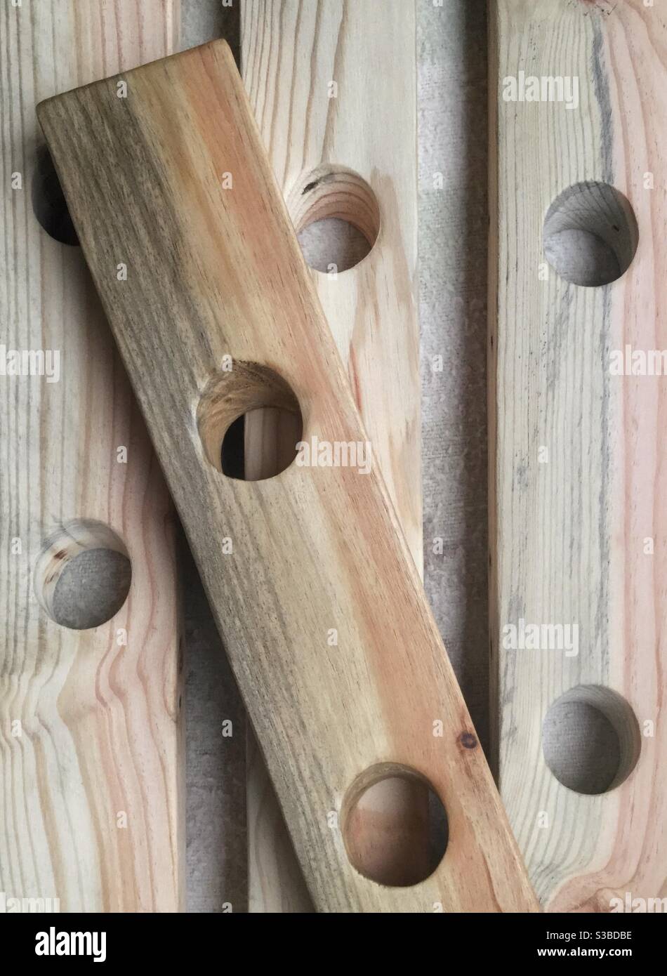 Waxing and polishing sparkling wine riddling rack staves, Catalonia, Spain. - Smartphone Captured Stock Image