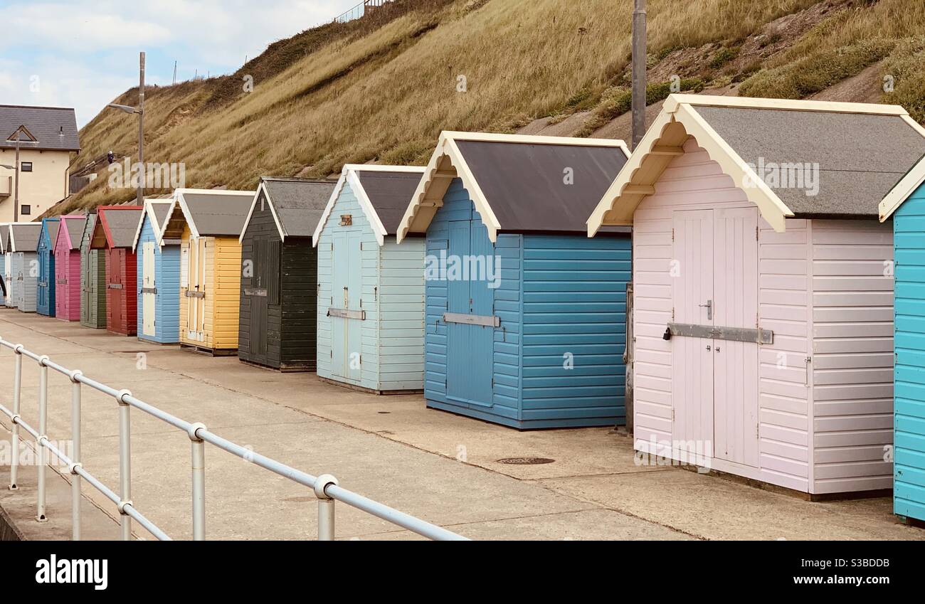 Row of beach huts at the seaside. Stock Photo