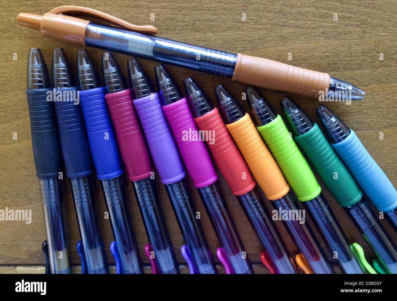 Colorful pens on drafting table Stock Photo