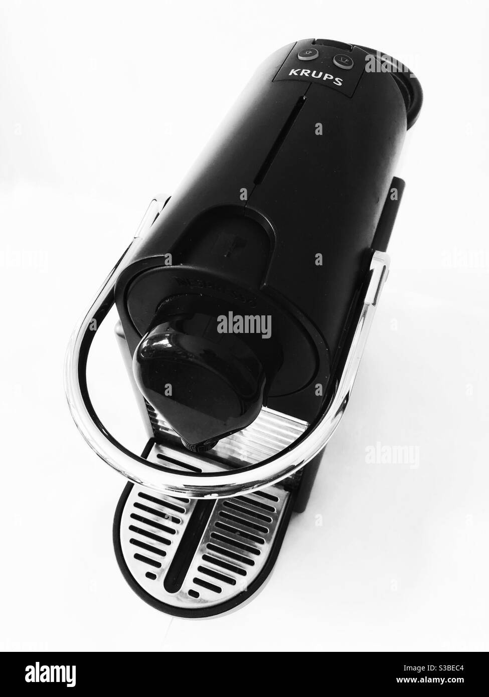 Graphic, high contrast black and white still life of coffee maker from above against a white background - Smartphone Captured Stock Image