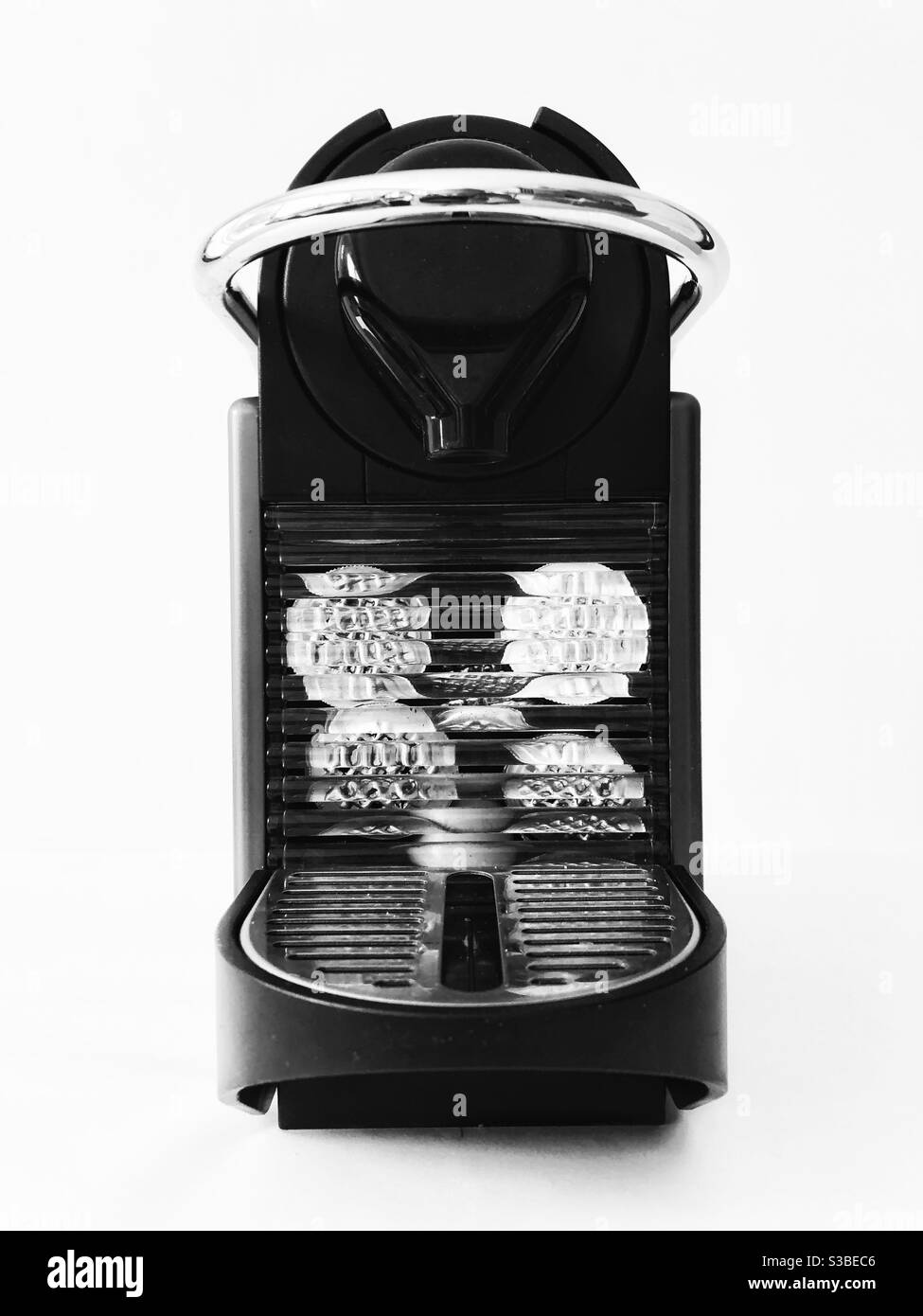 Graphic, high contrast black and white still life of coffee maker head on against a white background - Smartphone Captured Stock Image