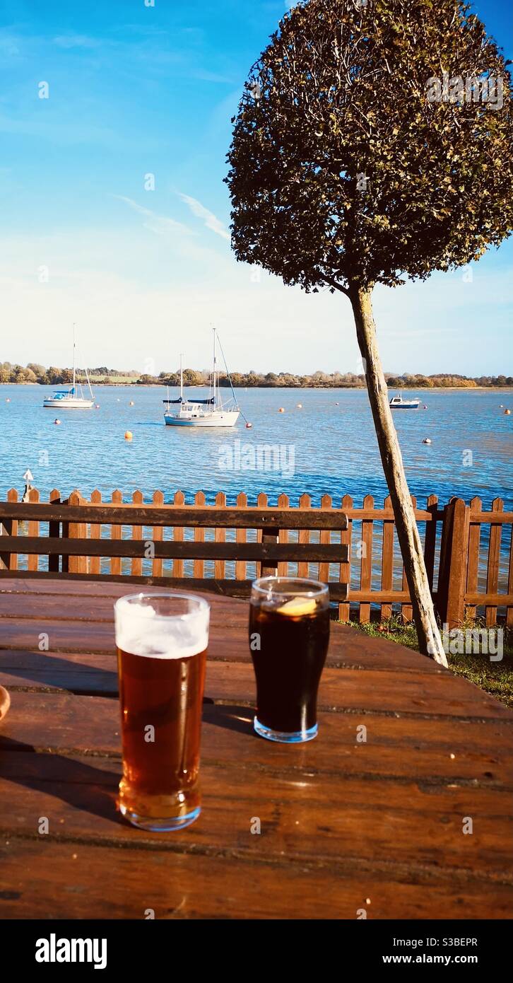 Drinks by the river Stock Photo Alamy