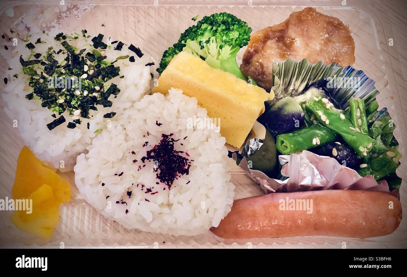 Onigiri rice triangles with umeboshi powder and nori with sausage and ...