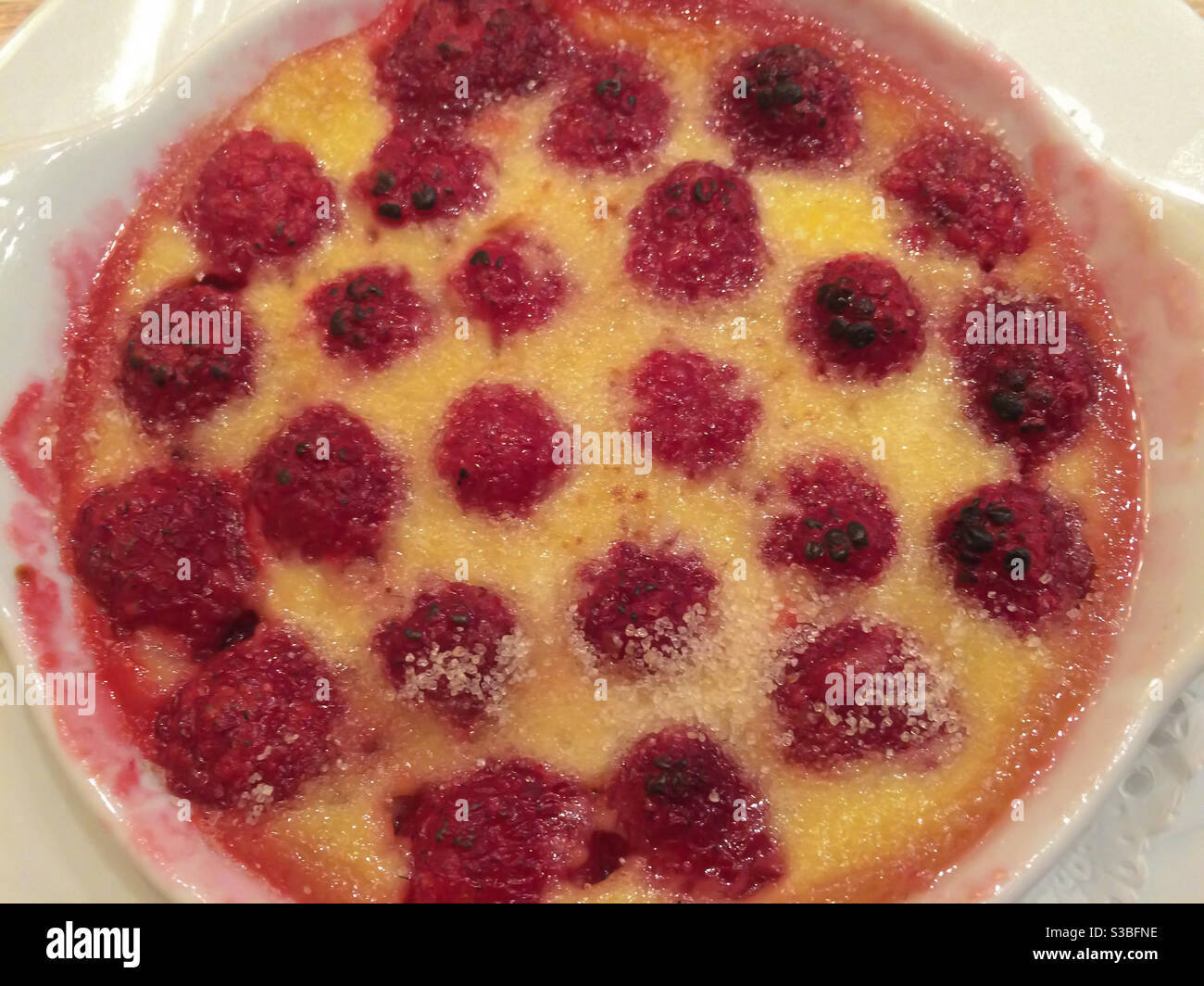 vanilla cream with raspberries - cream catalan - Smartphone Captured Stock Image