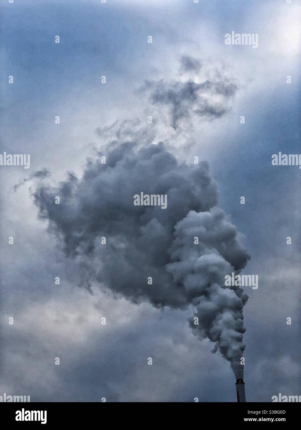 Smoke rising from industrial chimney - Smartphone Captured Stock Image