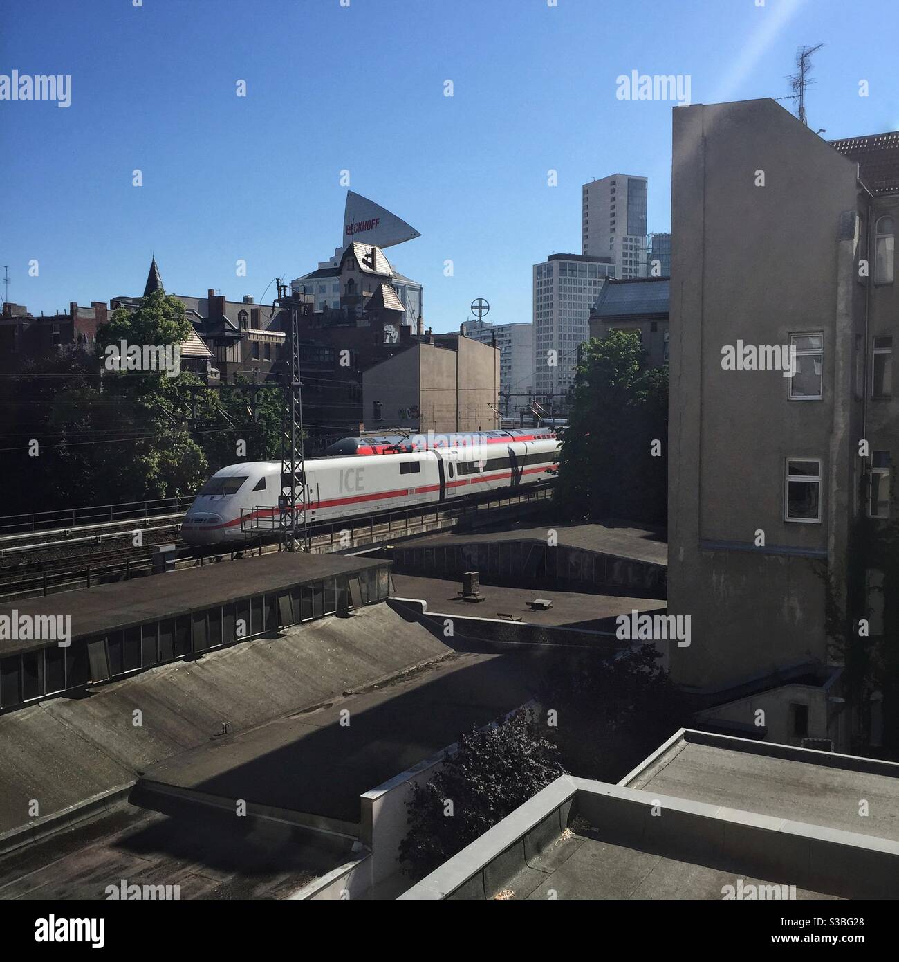 Intercity express train ICE passing through a built up area of Berlin Germany Stock Photo