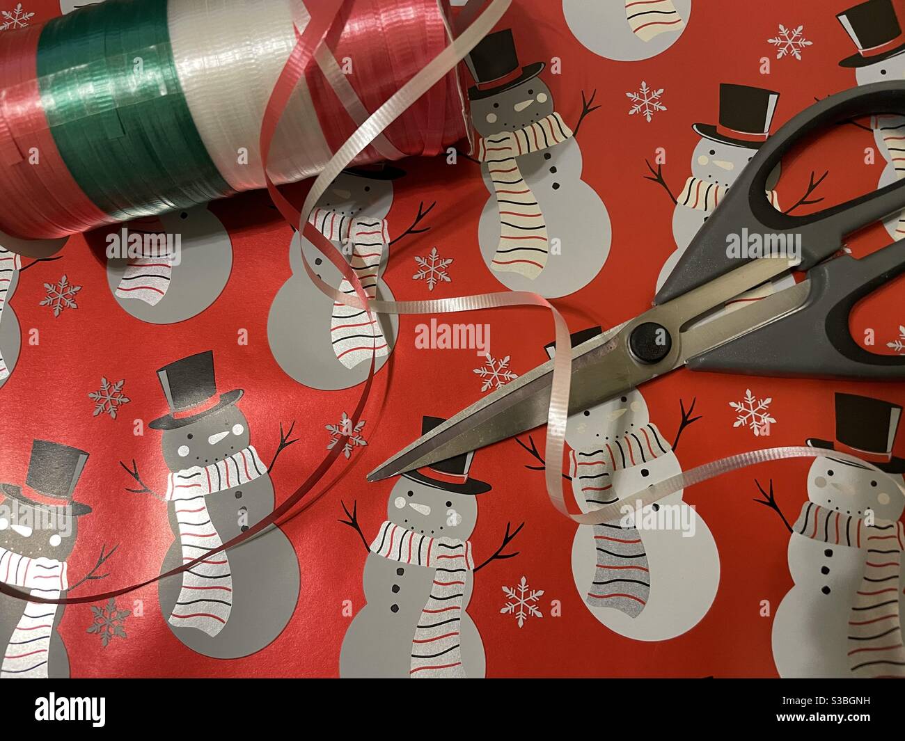 Christmas 2020 wrapping paper, scissors and Sellotape tape reel Stock Photo  - Alamy