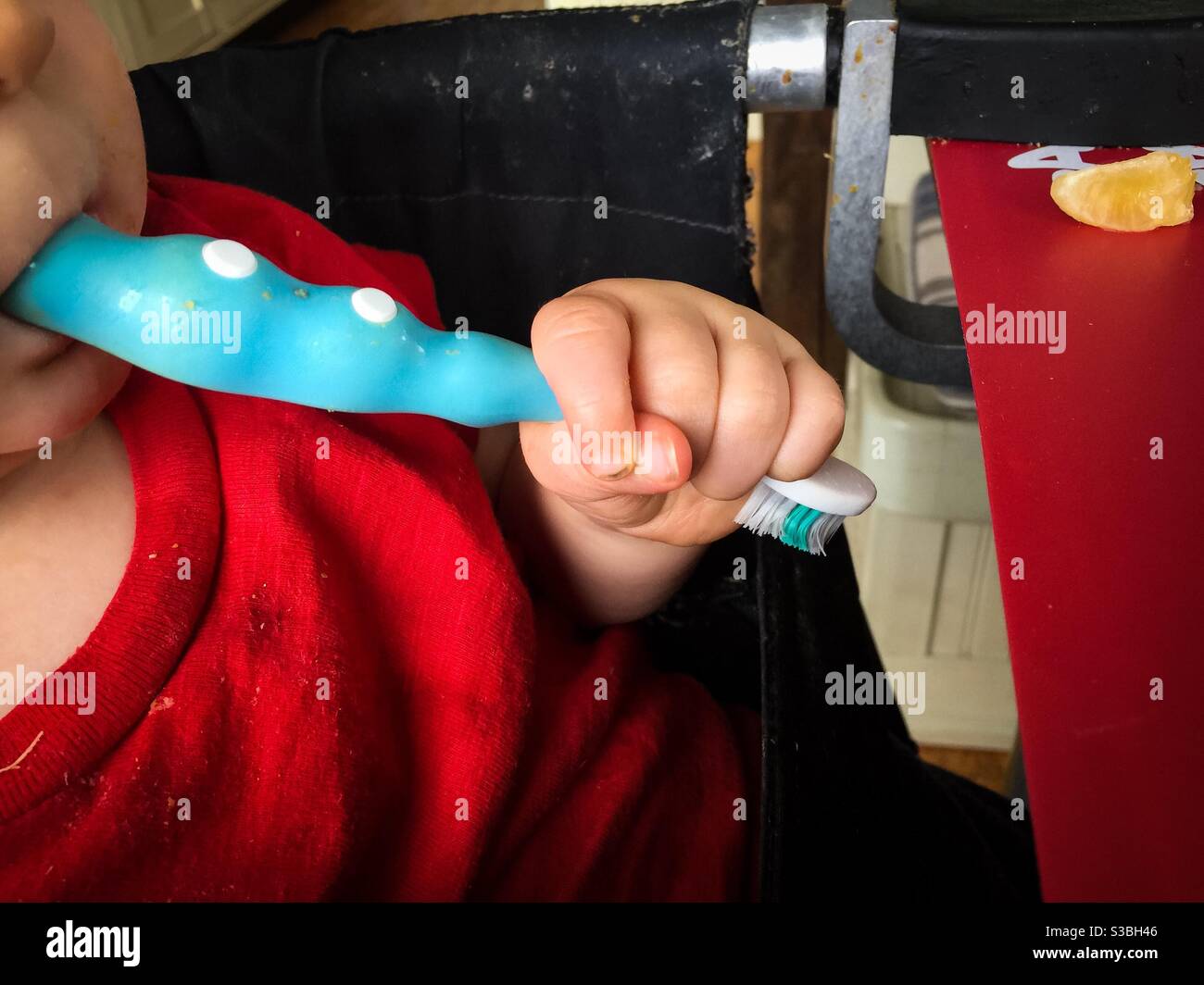 Brushing with the wrong end - Smartphone Captured Stock Image