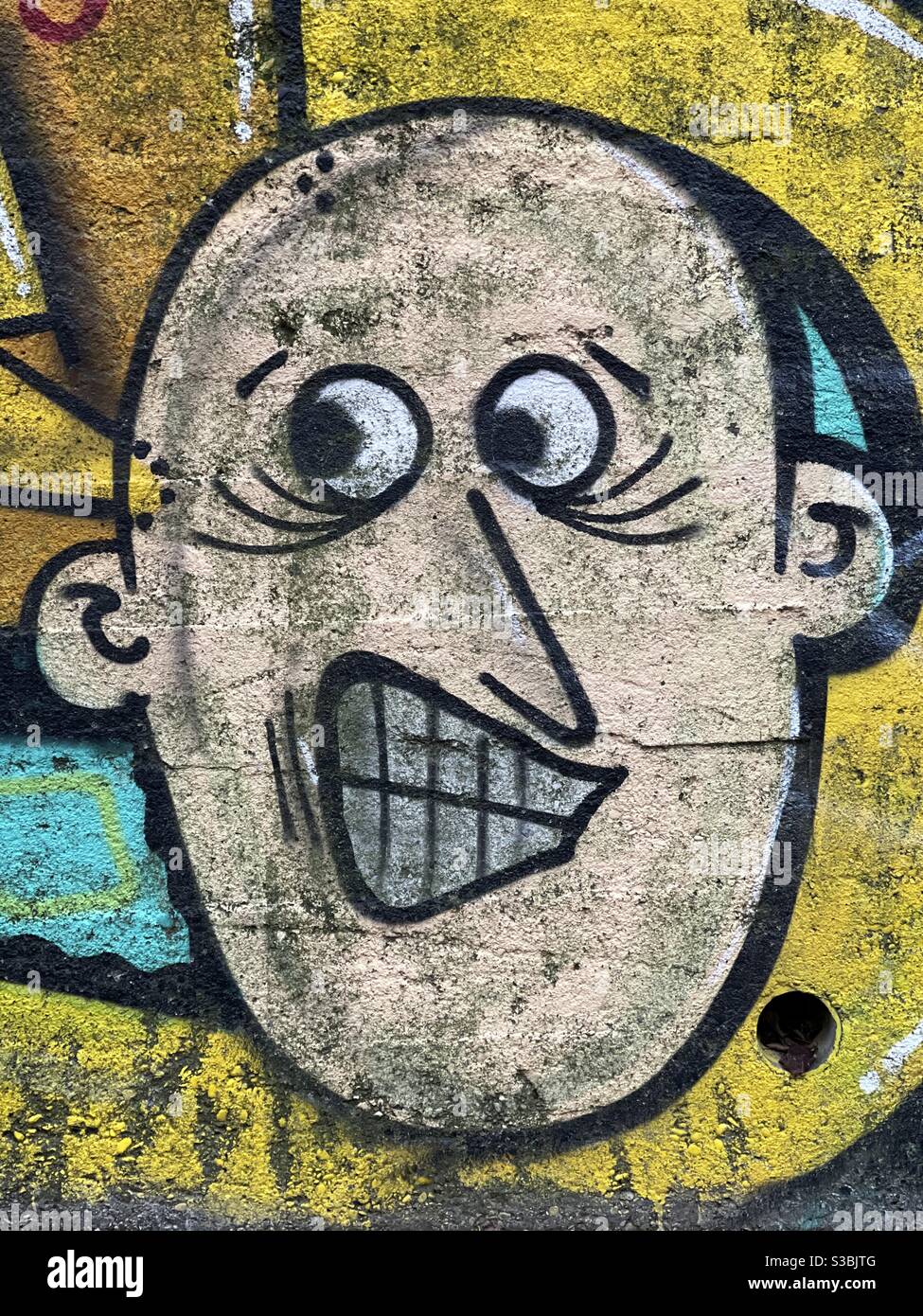 Boy stylized face painted on a wall - Smartphone Captured Stock Image