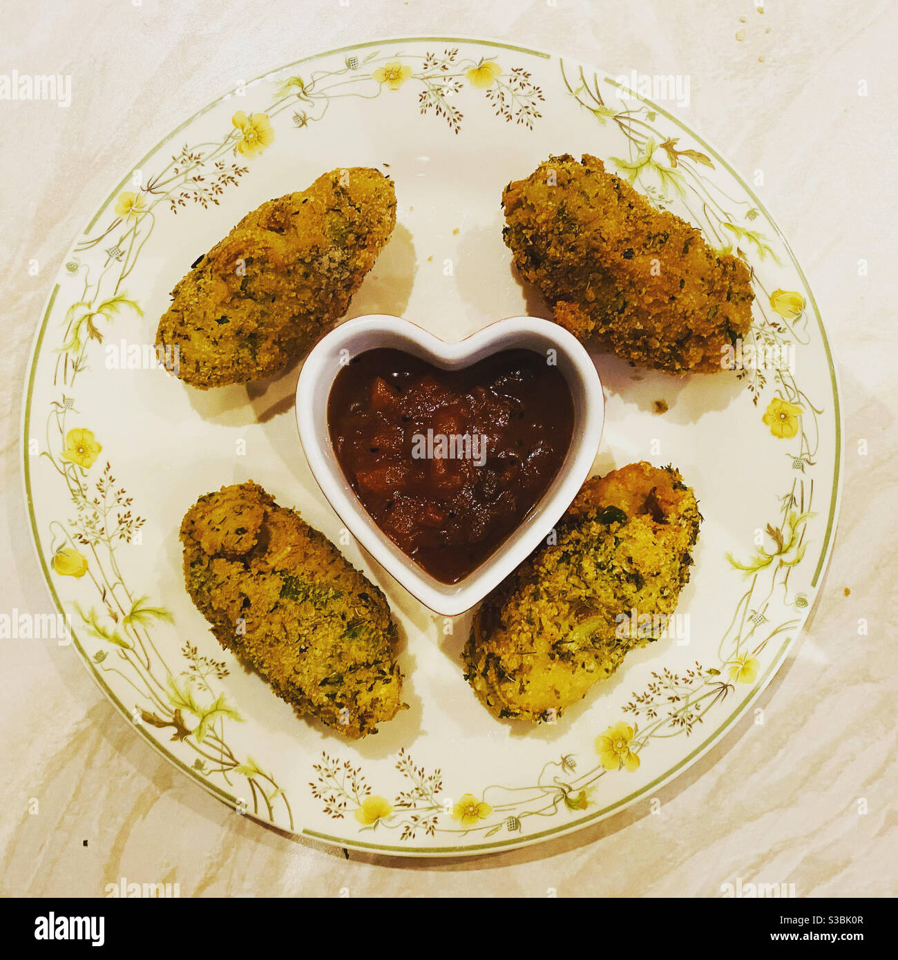 Glamorgan Sausages with tomato chutney. - Smartphone Captured Stock Image