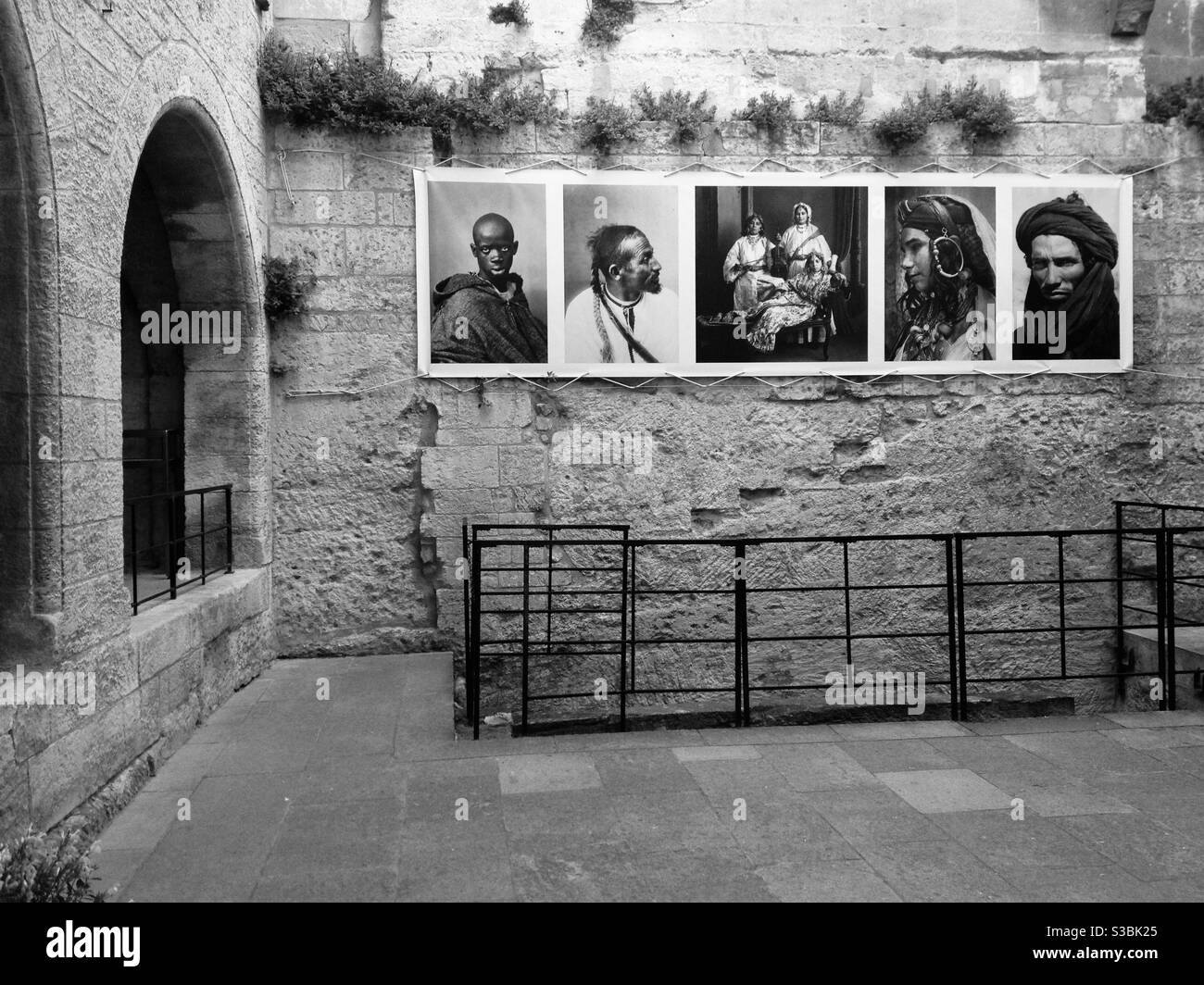 Photography exhibit of Moroccan portraiture, Les Baux-de-Provence, France. - Smartphone Captured Stock Image
