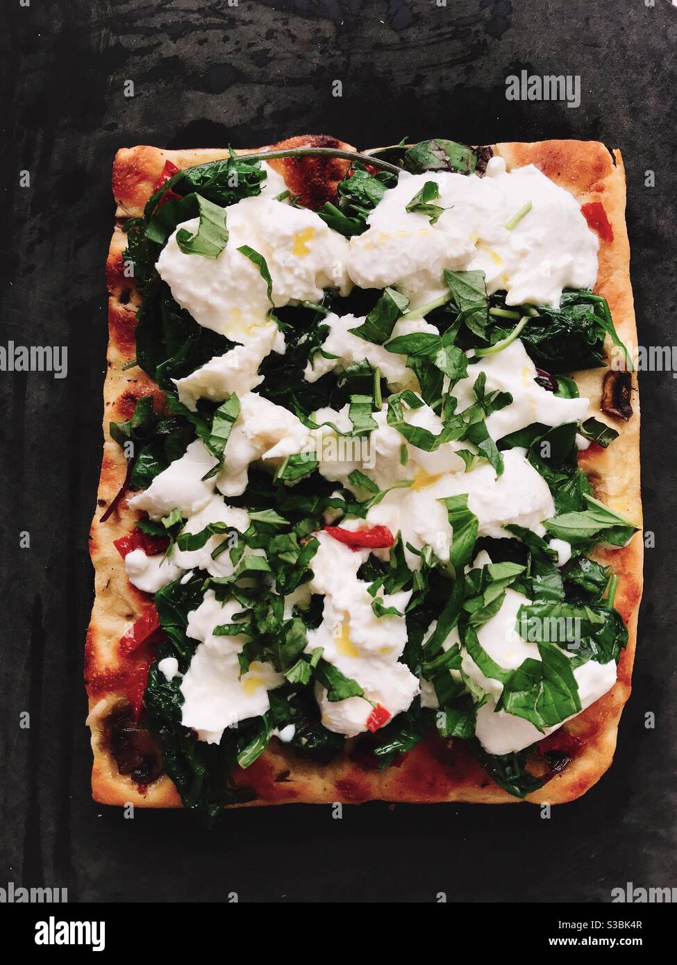 Vegetarian pizza square with mozzarella cheese and basil Stock Photo