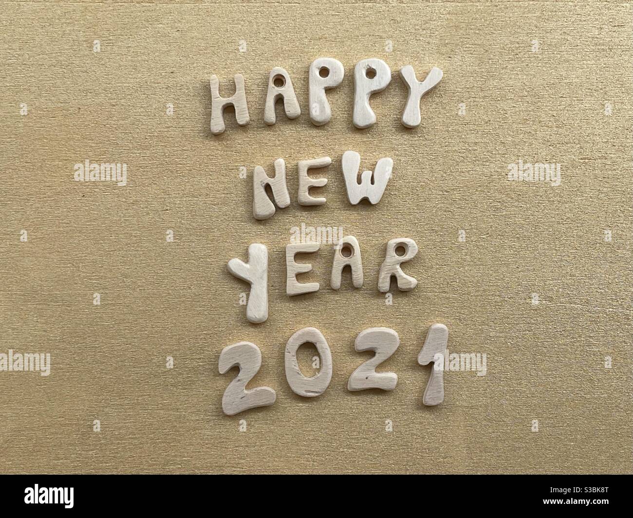Happy New Year 2021 with wooden letters and numbers - Smartphone Captured Stock Image