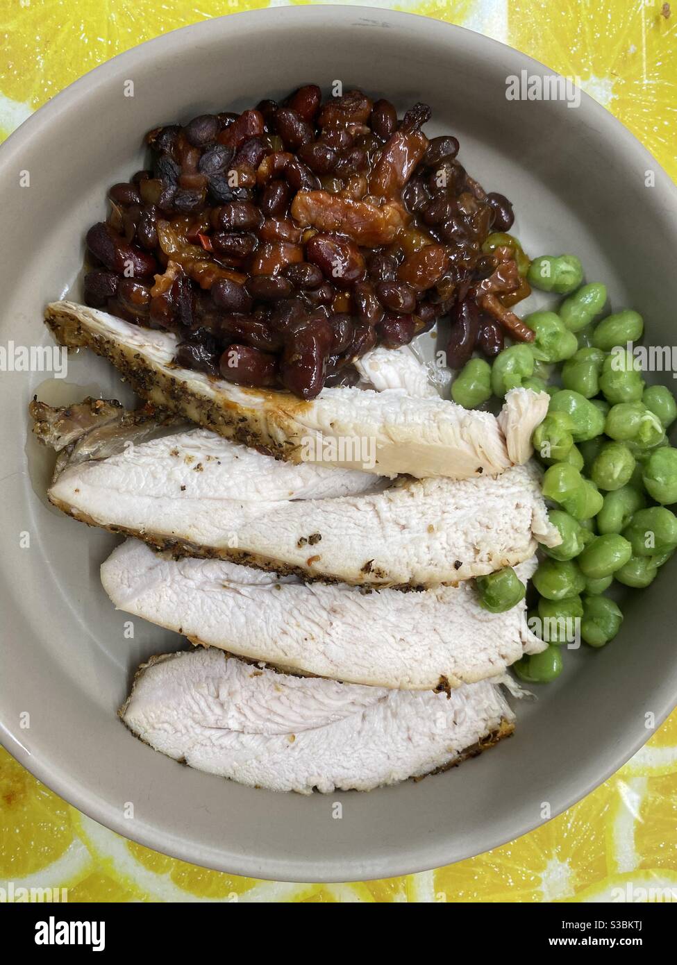 Roast Chicken Crown, smoked salt, pepper and garlic rub BBQ beans and marrowfat peas Stock Photo