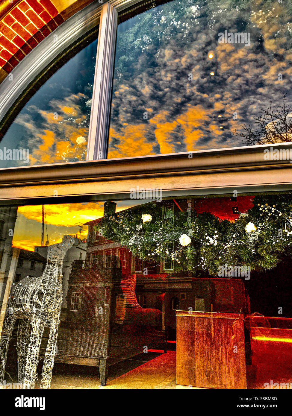 Hotel window reflections at sunset Stock Photo